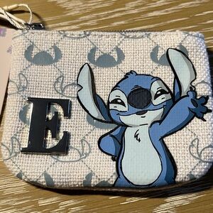 NWT. Disney Primark Stitch coin purse pouch with zipper and initial “E”